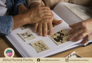 A tender moment: hands of a caregiver and an elderly person holding a photo album together, emphasizing the significance of memories in life.