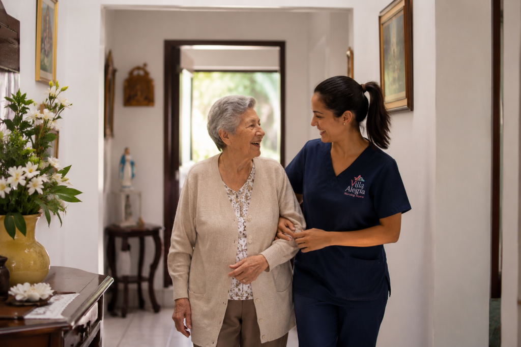 Caregiver assisting an older adult while walking through a comfortable assisted living residence.